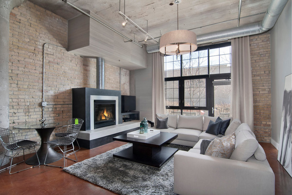 loft style living room with fireplace