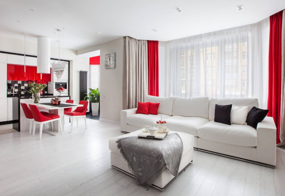 Red accents in the interior of a white living room