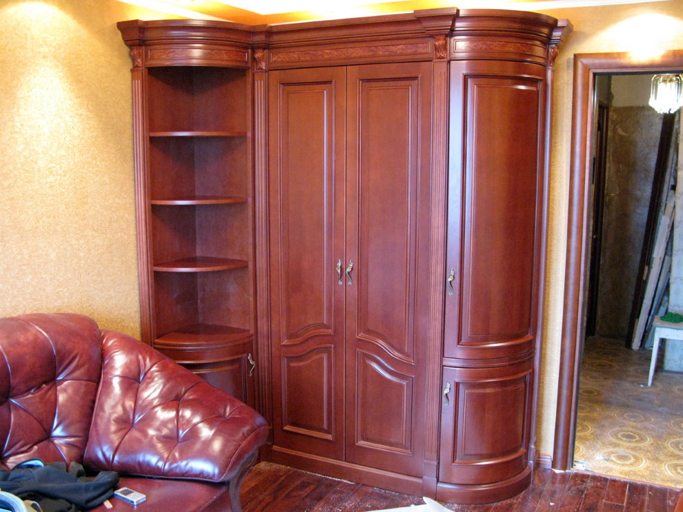 Classic corner cupboard in a room with a leather sofa