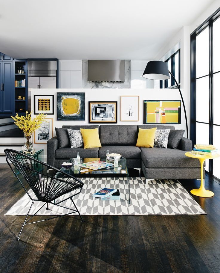 Yellow pillows in the living room with a gray sofa