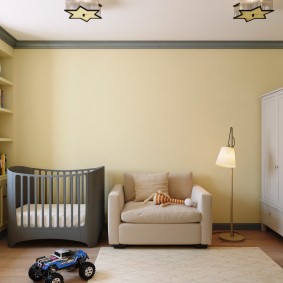 Gray bed in the room for the baby