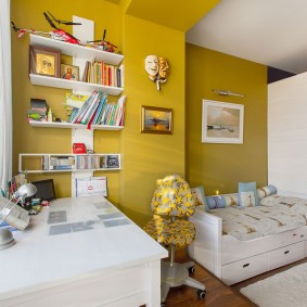 White shelves on a yellow wall