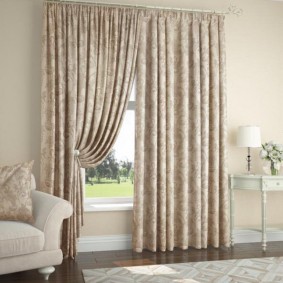Beige curtains with a discreet pattern