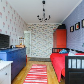 Striped rug in narrow bedroom