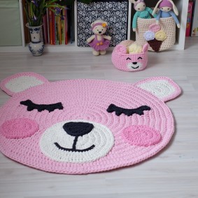 Knitted rug-shaped rug
