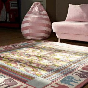 Square rug in front of a children's sofa