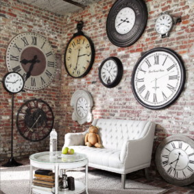 Collection of vintage clocks on a brick wall