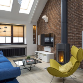 Metal fireplace in a modern style hall