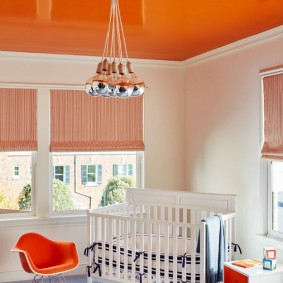 Orange ceiling in a newborn's room