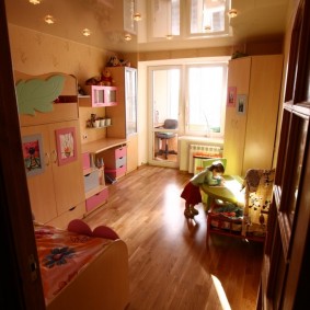 Wooden floor in a room with a balcony