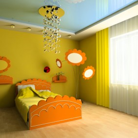 Children's bed with orange headboards
