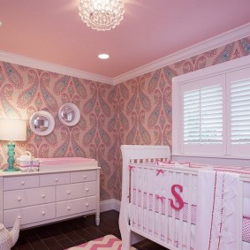 White crib for baby in the children's bedroom