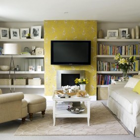 Built-in shelves in the hall with yellow wallpaper