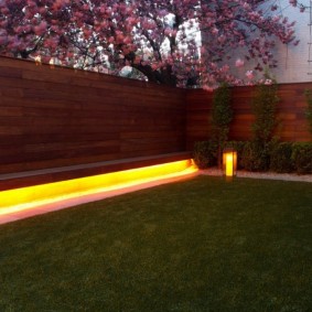 Yellow wooden fence lights