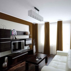 Sötét színű moduláris bútorok egy modern szobához