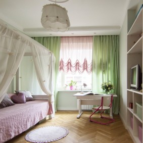 Light green curtains on the window of a room for a teenager