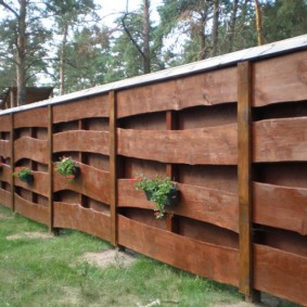 DIY fence made of thick boards