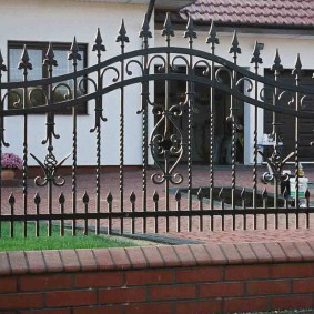 Elite fence with forged elements