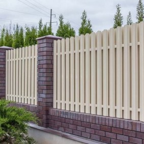 Beige galvanized picket fence sections