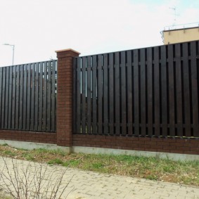 High fence on a strip foundation