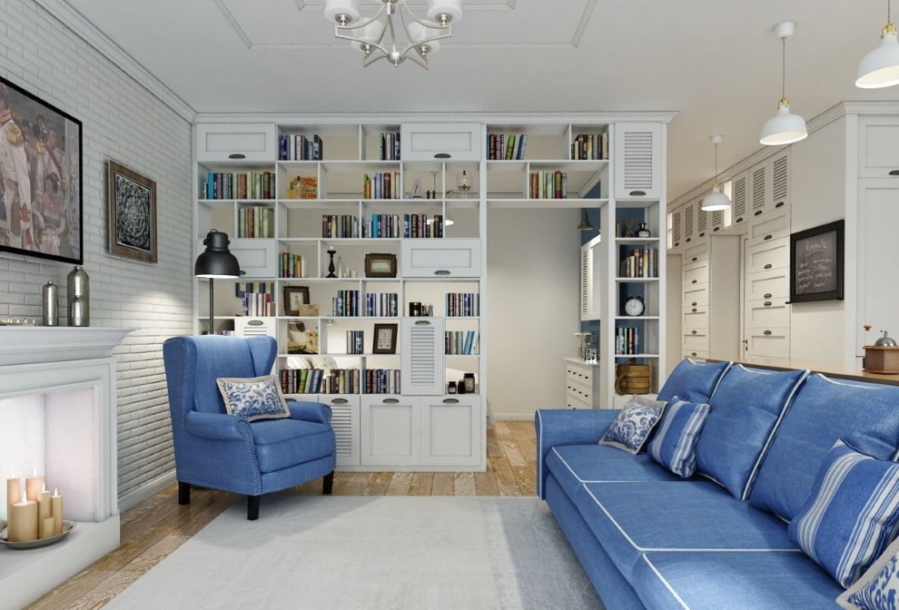 Biela knižnica v hale s modrou pohovkou