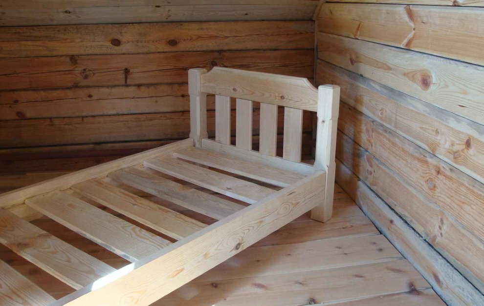 The frame of a homemade wooden bed for children