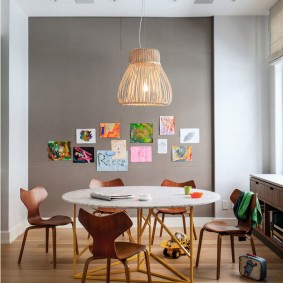 Children's drawings on a gray wall