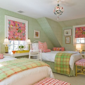 Green wallpaper in two girls room