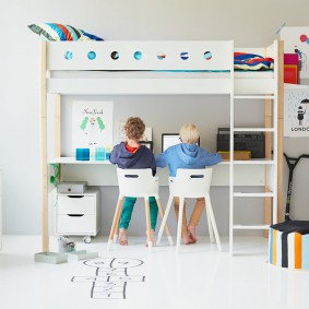 Workplace of schoolchildren in the lower tier of a bunk bed
