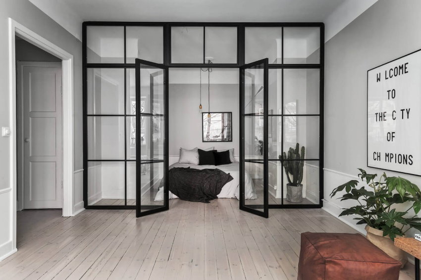Glass partition with hinged doors