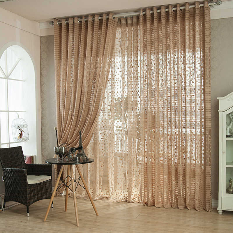 Beige tulle on the grommets in the living room