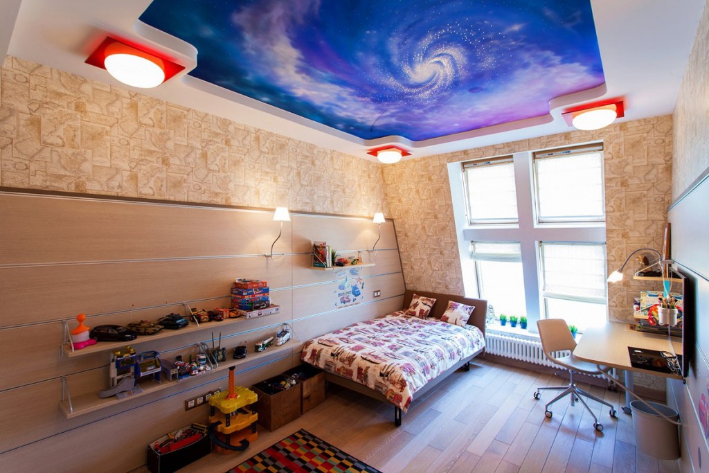 Overhead lights on the ceiling in a boy's room