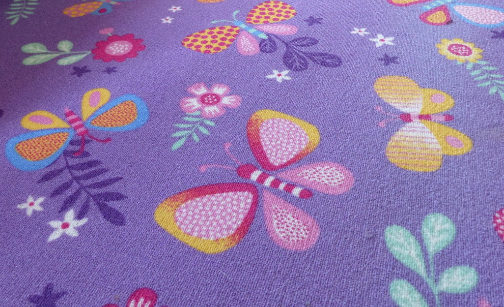 Colored butterflies on a children's carpet