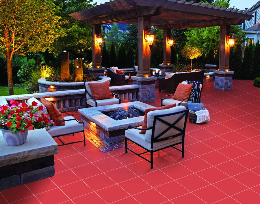 Red floor in a barbecue area with a wooden gazebo