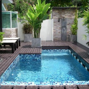 The backyard of a private house with a small pool