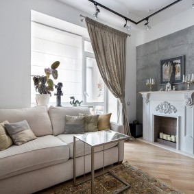 White fireplace against a gray wall