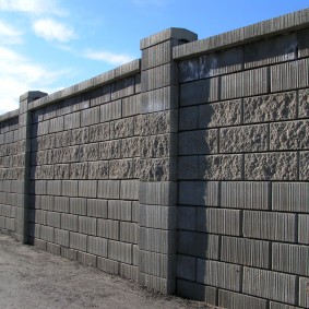 Solid concrete block fence