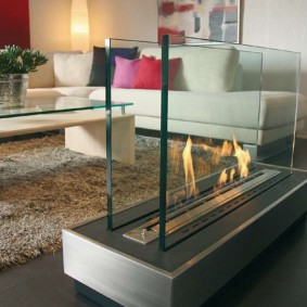 Glass walls on a simple bio-fireplace