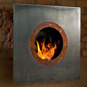 Square bio fireplace on a brick wall