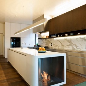Kitchen island butt with biofuel fireplace
