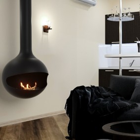 Black fireplace on a white wall background