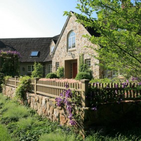 Wooden fence on a stone foundation