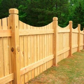 Wooden fencing of the territory of a summer cottage