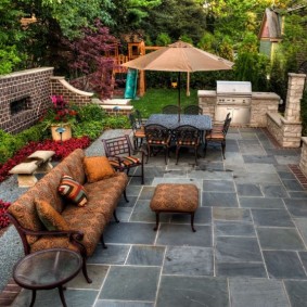 Outdoor furniture on a natural stone platform