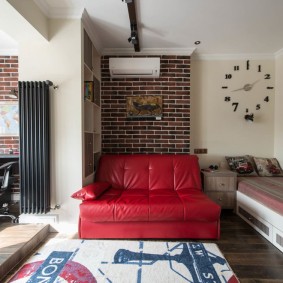 Red leather sofa in a schoolgirl's room