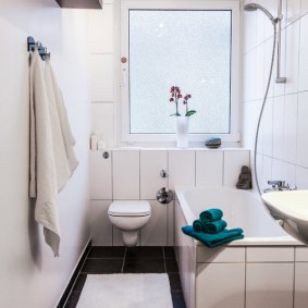 Bright bathroom with hanging toilet