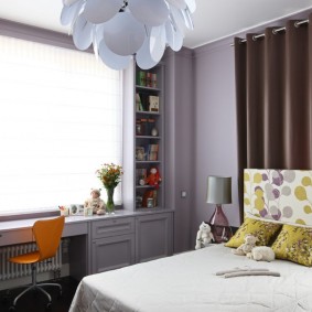 Bright bedroom with a table near the window