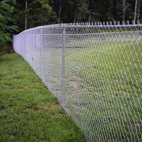 Steel pipe at the top of the mesh fence