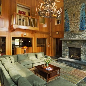 Stone fireplace in the living room with a high ceiling