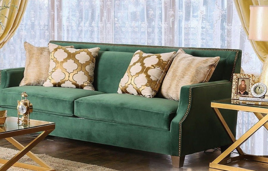 Direct sofa with armrests in the living room of the apartment
